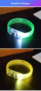 Detailed view of LED glow bracelets with internal bubble textures in green and yellow colors