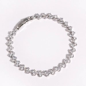 Detailed view of silver zircon bracelet with marquise and round cut stones on white