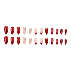Press-on nail set with burgundy cat-eye finish, pink bows and sparkling rhinestones