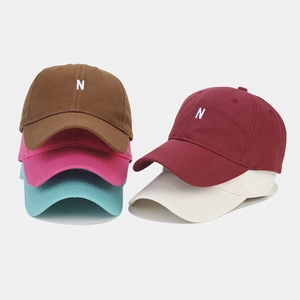 Minimalist cotton baseball cap with N letter embroidery available in various vibrant colors