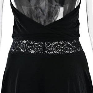 Detail of sexy backless black dress with intricate black lace patchwork on waist
