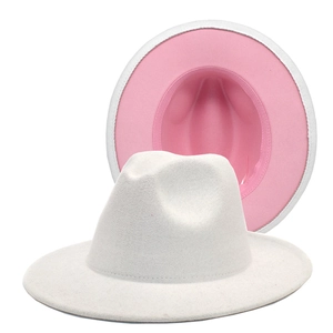 Detail of white wool fedora hat featuring a stylish pink color block wide brim