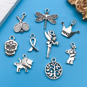 Detailed set of silver vintage charms including crown with Princess text and teddy bear
