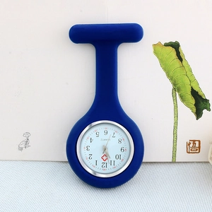 Detail of blue silicone fob watch for nurses with quartz movement on artistic background