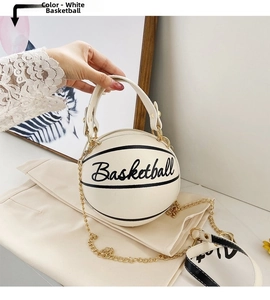 Detail of white basketball shaped crossbody bag with gold chain and pebble leather texture