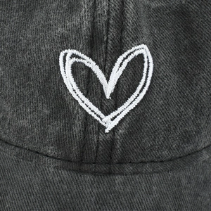 Faded charcoal grey washed cotton baseball cap with white heart embroidery logo