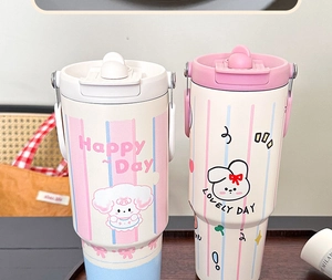 Detail of insulated straw tumblers featuring cute cartoon sheep and rabbit patterns