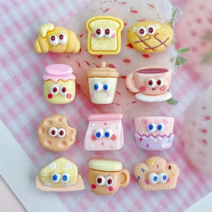 Set of 12 cute resin food charms for DIY crafts on a pink checkered background