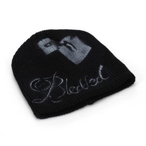 Detailed close-up of knitted beanie texture with grey lighter and Blackled embroidery