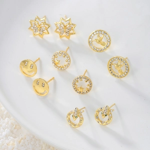 Gold plated earrings set with smiley face and star designs featuring micro zircon stones