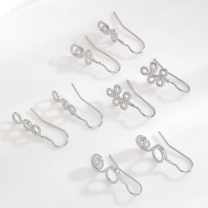 Set of 7 silver geometric non-piercing U-shaped nose clips with spiral knot designs