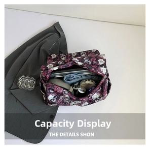 Detail showing the large capacity of the skull tote bag with laptop and clothes inside