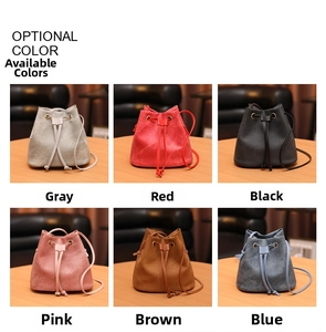 Multiple colors of drawstring bucket bags featuring matte texture and slim shoulder straps