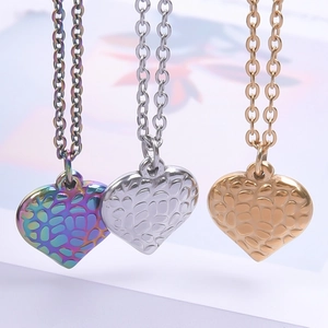 Golden, silver, and rainbow textured heart pendant necklaces in stainless steel finish