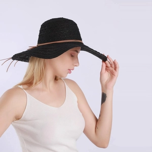 Summer black lace sun hat with large brim and tassel cord detail for elegant sun protection