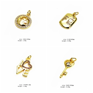Detail of four gold charm pendants with micro-set zircon and English size specifications
