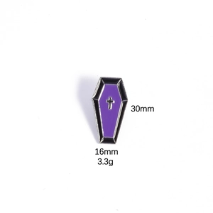 Detail view of purple coffin enamel pin with silver cross, sizing 30mm by 16mm