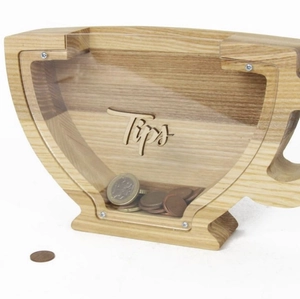 Close-up of a coffee cup shaped wooden tip box with clear glass and Tips engraving