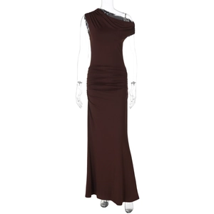 Detail of a brown one-shoulder ruched dress with floor-length pleats on a clear mannequin