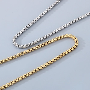 Macro shot of 18K gold and silver stainless steel box chains for men with sharp detail
