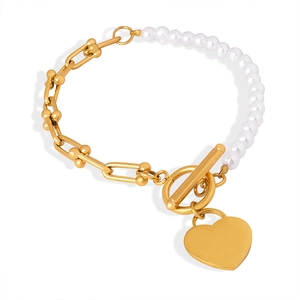 Elegant heart pendant bracelet with U-link chain and pearls on a white background