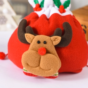 Detail of red Christmas felt gift bag with 3D reindeer design and plush trim closure