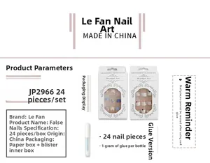 Detailed press on nails set with 24 pieces in blue and white featuring glue and packaging