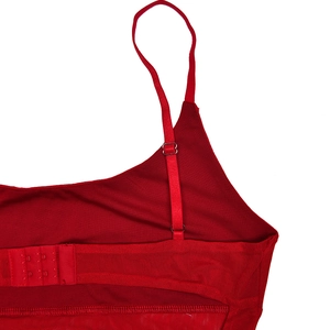 Detail of red rhinestone dress back with adjustable straps and three-row hook closures