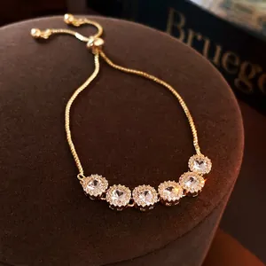 Gold plated bracelet with square cubic zirconia stones and adjustable sliding clasp