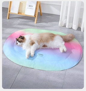 Macro shot of a long-haired cat on a gradient rainbow cooling pet mat for summer