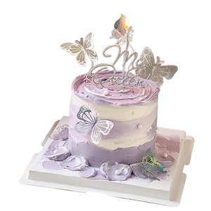 Purple and white gradient cake with silver butterflies and My Queen rhinestone cake topper