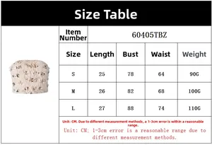 Tabella taglie dettagliata per crop top con paillettes e piume con misure S, M, L