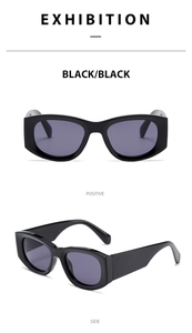 Detail view of retro square black sunglasses with smoke lenses and thick glossy frame