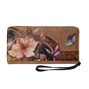 Detailed view of tan faux leather wallet with floral patterns, butterflies and wrist strap