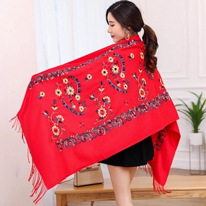 Detailed embroidery view of red floral pashmina shawl with tassels on the edge