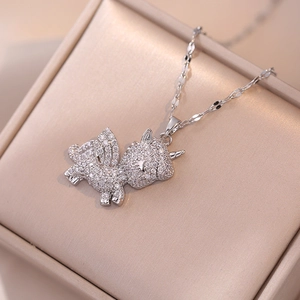 Macro shot of a shimmering silver unicorn pendant with full zircon inlay on a jewelry box