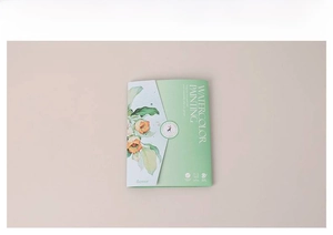 Close-up of a floral watercolor painting book cover with 12 solid pigment colors for kids