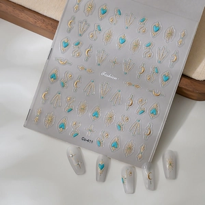 Detail of star and moon turquoise nail stickers with golden foil heart patterns