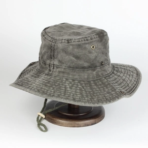 Men's washed cotton bucket hat in dark grey with adjustable drawstring on wooden stand
