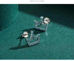 Macro shot of S925 sterling silver turquoise crown earrings with intricate pave setting