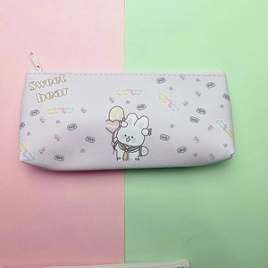 Close-up of cute purple cartoon pencil case with sweet bear print and cross-grain texture