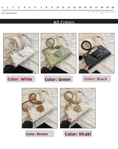Close-up of quilted pattern handbag with braided handle and magnetic snap closure
