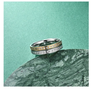Macro view of two-tone titanium ring with micro-pave crystals on dark green stone