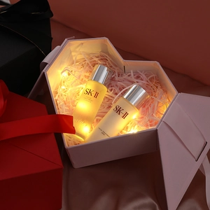 Pink heart-shaped gift box with raffia and LED lights for birthdays and weddings