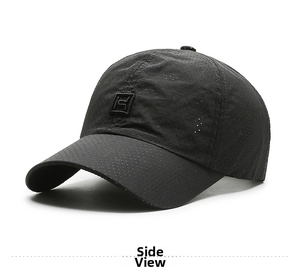 Detail of black sports baseball cap showing breathable laser-perforated mesh fabric