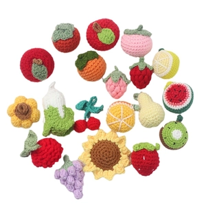 Handmade crochet fruit and vegetable charms including apple strawberry and sunflower