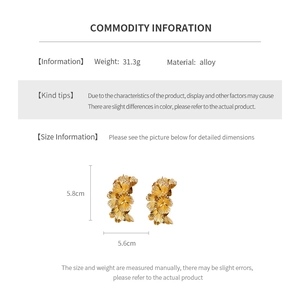 Detailed size and weight specs for gold leaf drop earrings in an information chart