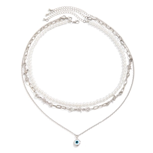 Three-layer layered necklace featuring pearls, silver wire chain, and evil eye pendant