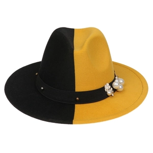 Detail showing wool felt fedora with pearl embellishments and white flower ribbon