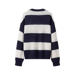 Close-up back view of blue and white striped knit sweater showing texture and ribbed cuffs